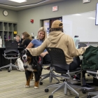 Drax being petted by students