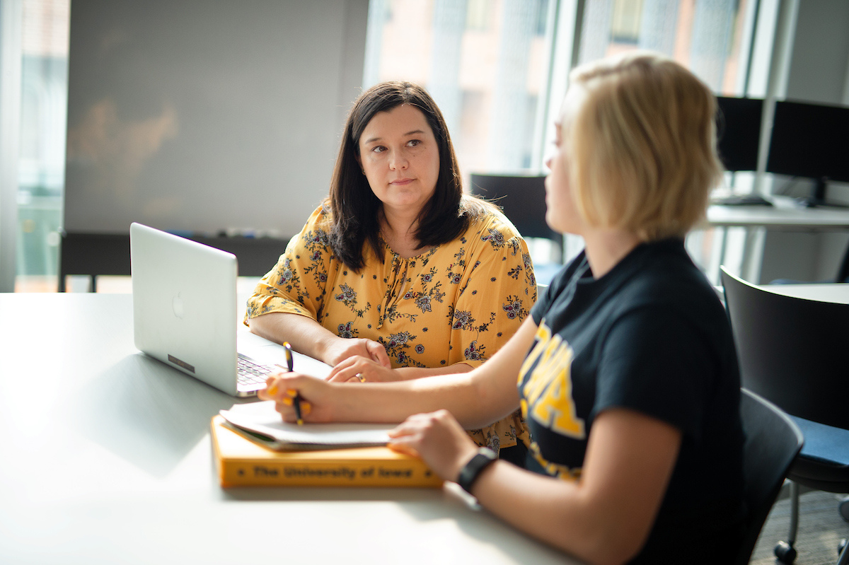 A student and an advisor talking