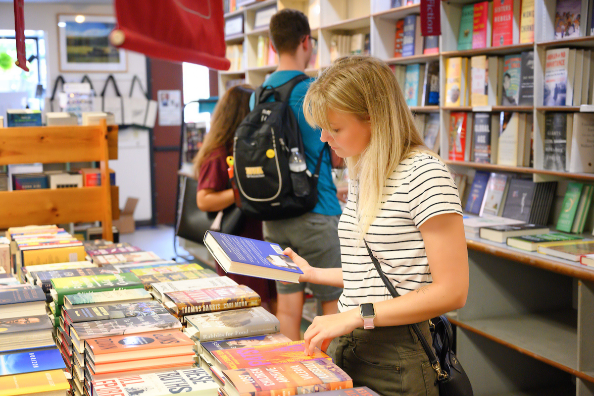 A person looks at books