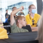 Kid participating at UISPEAKS camp kinnick tour 2022, photo by jtobin