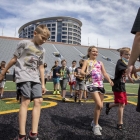 Kids training at UISPEAKS camp kinnick tour 2022, photo by jtobin