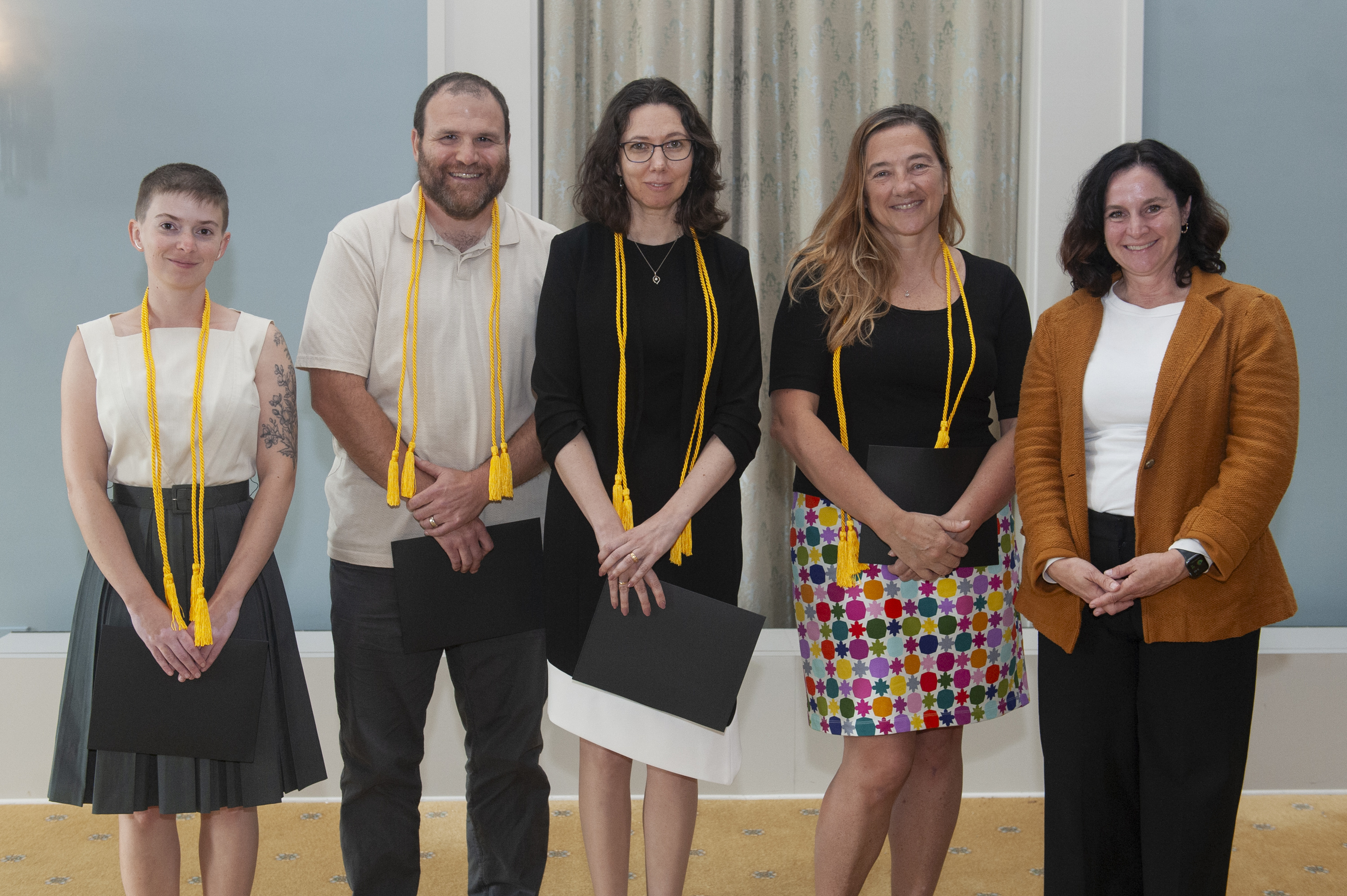 Anne Sand, Nicholas Martini, Elizabeth Kleiman, and Christine Shea stand with Sara Sanders