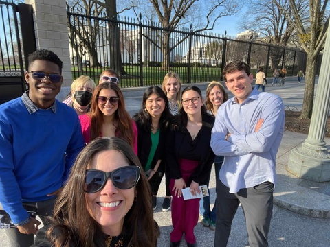 Student standing in front of the White House