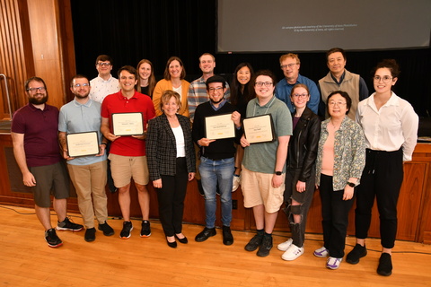 Teaching assistants and faculty from the Department of Mathematics pose for a photo with President Wilson.