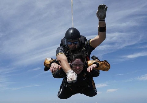 Rosemary moore tandem jumping with a golden knight