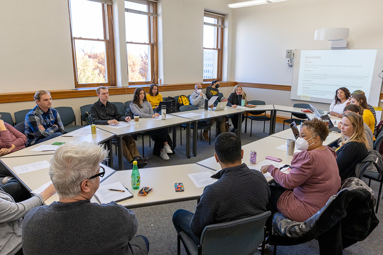 CLAS DEI Committee meets around a table