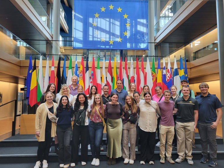 Students pose on a trip in Europe