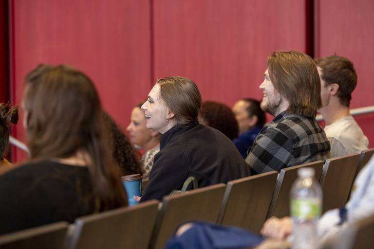 staff at the event listening and socializing